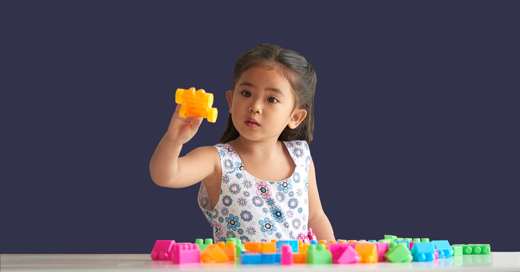 little girl playing with lego