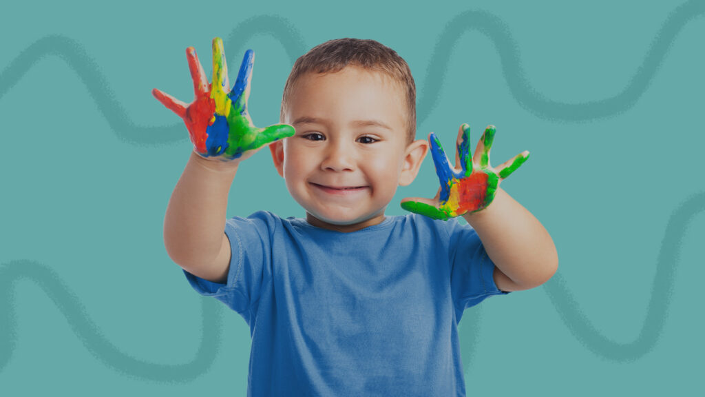 kid with paint on his hands